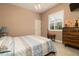 Comfortable bedroom featuring a wooden headboard bed, light blue bedding and bright natural light at 3577 Maribella Dr, New Smyrna Beach, FL 32168