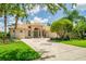 This gorgeous single-story home boasts lush landscaping, a circular driveway, and impeccable curb appeal at 3577 Maribella Dr, New Smyrna Beach, FL 32168