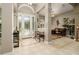 The foyer is decorated with art and detailed tile work, leading into a home office at 3577 Maribella Dr, New Smyrna Beach, FL 32168