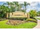 The Maribella community sign is surrounded by lush landscaping and colorful flowers at 3577 Maribella Dr, New Smyrna Beach, FL 32168