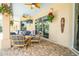 Comfortable outdoor patio featuring rattan seating, ceiling fans and tropical decor at 3577 Maribella Dr, New Smyrna Beach, FL 32168