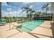 Sparkling screened-in pool with lush landscaping and serene lake views at 3577 Maribella Dr, New Smyrna Beach, FL 32168