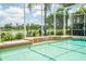 Tranquil pool area with a relaxing waterfall and views of the lake at 3577 Maribella Dr, New Smyrna Beach, FL 32168