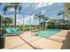 Screened pool area with waterfront views and lush tropical landscaping at 3577 Maribella Dr, New Smyrna Beach, FL 32168