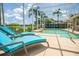 Screened pool area with lounge chairs and beautiful water views at 3577 Maribella Dr, New Smyrna Beach, FL 32168
