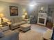 Inviting living room with a fireplace, soft lighting, comfortable seating, and bright accents at 38 Cedar Dunes Dr, New Smyrna Beach, FL 32169