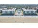 Beachfront condominium complex aerial view showing beach access, pool, and manicured grounds at 4151 S Atlantic Ave # 3090, New Smyrna Beach, FL 32169