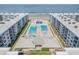 Aerial shot showcases beachfront condos with dual swimming pools and clear ocean views at 4151 S Atlantic Ave # 3090, New Smyrna Beach, FL 32169