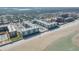 Stunning aerial view of a beachfront condo with multiple pools and a sprawling sandy beach at 4151 S Atlantic Ave # 3090, New Smyrna Beach, FL 32169