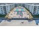 Aerial view of beachfront condos featuring dual swimming pools, lush landscaping and beach access at 4151 S Atlantic Ave # 3090, New Smyrna Beach, FL 32169