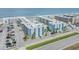 Beautiful aerial view of beachside condos with a community pool, parking, and ocean views at 4151 S Atlantic Ave # 3090, New Smyrna Beach, FL 32169