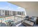 Relaxing balcony with comfortable seating overlooking the pool, offering a delightful outdoor space at 4151 S Atlantic Ave # 3090, New Smyrna Beach, FL 32169