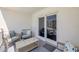 Cozy balcony with comfortable seating and sliding glass doors, perfect for enjoying outdoor living at 4151 S Atlantic Ave # 3090, New Smyrna Beach, FL 32169