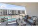 Relaxing balcony with comfortable seating overlooking the pool, offering a delightful outdoor space at 4151 S Atlantic Ave # 3090, New Smyrna Beach, FL 32169