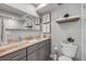 Bathroom with double vanity, marble countertop, large mirror, and a glass enclosed shower at 4151 S Atlantic Ave # 3090, New Smyrna Beach, FL 32169