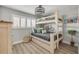 Bright bedroom with natural light, featuring a bunk bed and coastal-themed decor at 4151 S Atlantic Ave # 3090, New Smyrna Beach, FL 32169