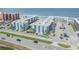 Coastal condominium complex view, featuring a well-maintained facade, balconies, parking, and landscaped grounds at 4151 S Atlantic Ave # 3090, New Smyrna Beach, FL 32169
