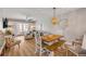 Cozy living room featuring an indoor dining space and access to a private balcony with a view at 4151 S Atlantic Ave # 3090, New Smyrna Beach, FL 32169