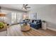 Comfortable living room with an indoor/outdoor living space that offers a view from a private balcony at 4151 S Atlantic Ave # 3090, New Smyrna Beach, FL 32169