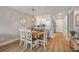 Open-concept living space with dining area, breakfast bar, and seamless flow to kitchen at 4151 S Atlantic Ave # 3090, New Smyrna Beach, FL 32169