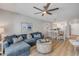 Living room with open floor plan features dining area and bar seating to updated kitchen at 4151 S Atlantic Ave # 3090, New Smyrna Beach, FL 32169