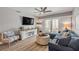 Relaxing living room with sliding doors to private balcony and stylish furnishings and decor at 4151 S Atlantic Ave # 3090, New Smyrna Beach, FL 32169