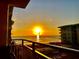 Stunning sunrise over the ocean seen from the balcony, showcasing serene coastal living at 4151 S Atlantic Ave # 3090, New Smyrna Beach, FL 32169