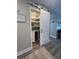 View of the well-organized pantry featuring a sliding barn door and beverage cooler at 4151 S Atlantic Ave # 3090, New Smyrna Beach, FL 32169