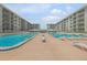Beautiful pools with many lounge chairs and a gazebo available for residents at 4151 S Atlantic Ave # 3090, New Smyrna Beach, FL 32169