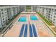 Beautiful condo complex featuring dual swimming pools, a shuffleboard court, and ample lounging areas at 4151 S Atlantic Ave # 3090, New Smyrna Beach, FL 32169