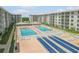Lovely condo community with two shimmering swimming pools, shuffleboard, and plenty of seating at 4151 S Atlantic Ave # 3090, New Smyrna Beach, FL 32169