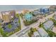 Beautiful aerial view of a mint green condo complex by the ocean with well-manicured landscaping at 423 S Atlantic Ave # 301, New Smyrna Beach, FL 32169