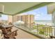 Spacious balcony with comfortable seating offers stunning views of the ocean at 423 S Atlantic Ave # 301, New Smyrna Beach, FL 32169