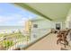 Expansive balcony offering beach views, complemented by comfortable outdoor seating at 423 S Atlantic Ave # 301, New Smyrna Beach, FL 32169