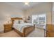 Cozy bedroom with a sleigh bed and a window view at 423 S Atlantic Ave # 301, New Smyrna Beach, FL 32169