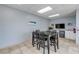Well-lit community room features a large table and seating area, a TV, and a kitchenette at 423 S Atlantic Ave # 301, New Smyrna Beach, FL 32169