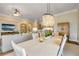 Bright dining room with chandelier, an open layout, and adjacent living space at 423 S Atlantic Ave # 301, New Smyrna Beach, FL 32169