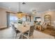 Bright dining room with ocean view, chandelier, and open layout at 423 S Atlantic Ave # 301, New Smyrna Beach, FL 32169
