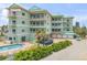 Beautiful condominium complex featuring a private pool and balconies that offer ocean views at 423 S Atlantic Ave # 301, New Smyrna Beach, FL 32169