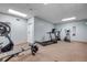 Community gym featuring weight training equipment, exercise machines, and ceiling lighting at 423 S Atlantic Ave # 301, New Smyrna Beach, FL 32169