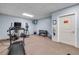 Community fitness center featuring a treadmill, elliptical, weights, and wall-mounted TV at 423 S Atlantic Ave # 301, New Smyrna Beach, FL 32169