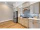 Modern kitchen showcasing custom cabinets, stylish backsplash, and stainless steel refrigerator at 423 S Atlantic Ave # 301, New Smyrna Beach, FL 32169