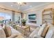 Relaxing living room with water view, fireplace, and outdoor patio at 423 S Atlantic Ave # 301, New Smyrna Beach, FL 32169