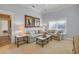 Comfortable living room features neutral furniture, art and a sunlit window at 423 S Atlantic Ave # 301, New Smyrna Beach, FL 32169