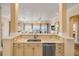 Open-concept living room offers ocean views, opening from an adjacent contemporary kitchen space at 423 S Atlantic Ave # 301, New Smyrna Beach, FL 32169