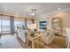 Comfortable living room with a view to kitchen, ocean view, and fireplace at 423 S Atlantic Ave # 301, New Smyrna Beach, FL 32169