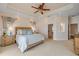Bright main bedroom with a ceiling fan, natural light, and neutral tones at 423 S Atlantic Ave # 301, New Smyrna Beach, FL 32169