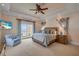 Relaxing main bedroom with an ocean view, ceiling fan, and walk-out patio at 423 S Atlantic Ave # 301, New Smyrna Beach, FL 32169
