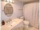 Cozy bathroom features a shower and tub combination with a matching oval mirror at 4435 S Atlantic Ave # 416, Port Orange, FL 32127