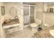 This bathroom features granite counters, vanity with seated makeup area, and shower at 4435 S Atlantic Ave # 416, Port Orange, FL 32127